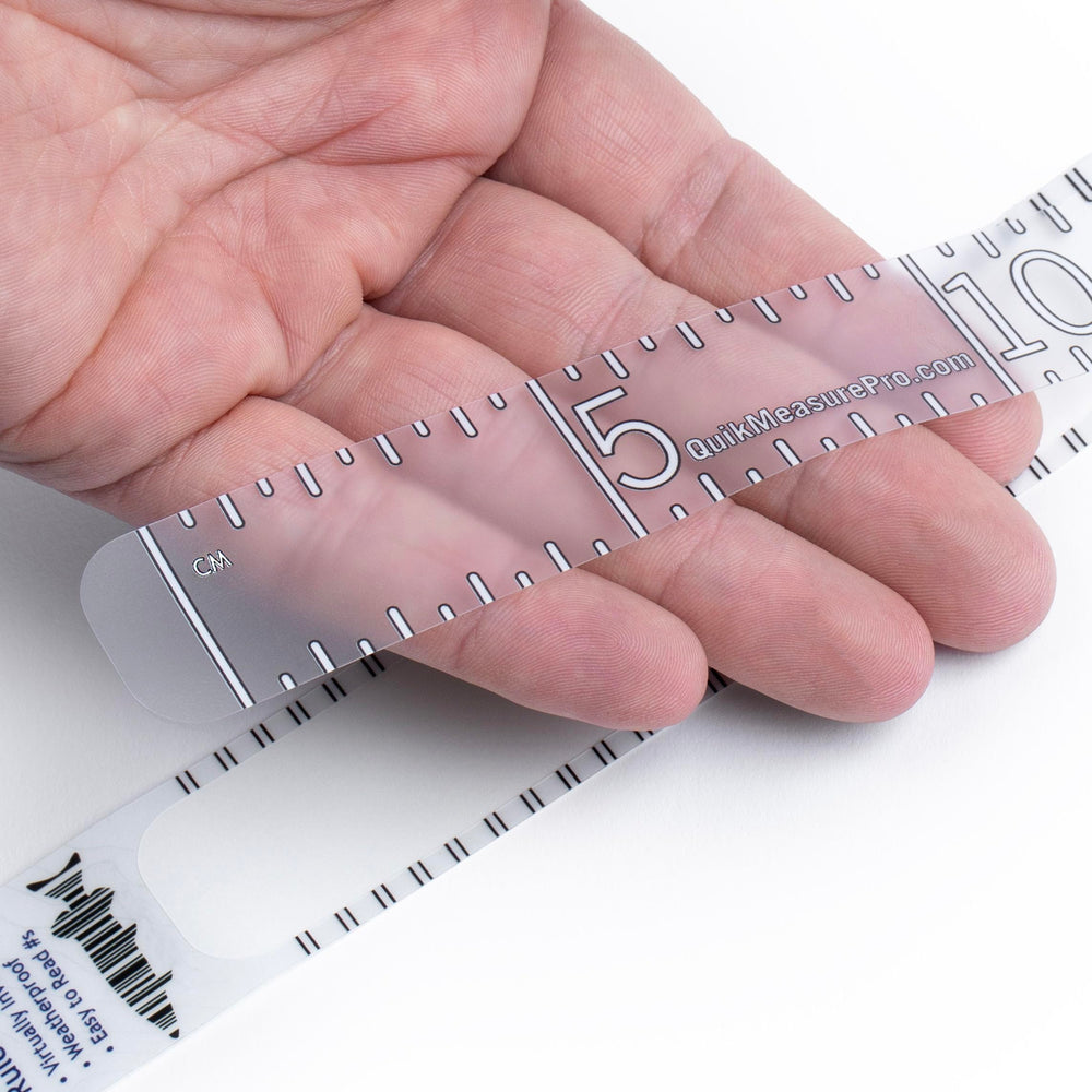 Quik Measure Pro fish ruler 100cm decal with clear metric marks on a boat.