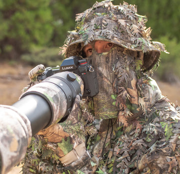 QuikCamo leafy camo gloves packaging demonstrates lightweight reliability for hunters.