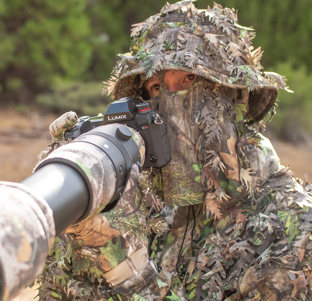 QuikCamo leafy camo gloves packaging demonstrates lightweight reliability for hunters.