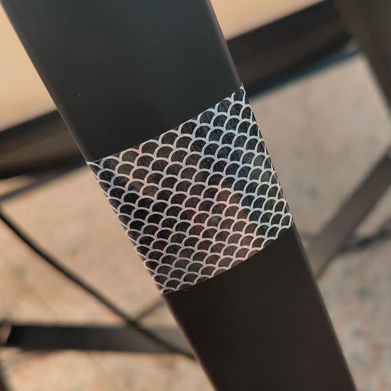 Quintathletic adhesive-backed holographic film bonds easily to lure surfaces.