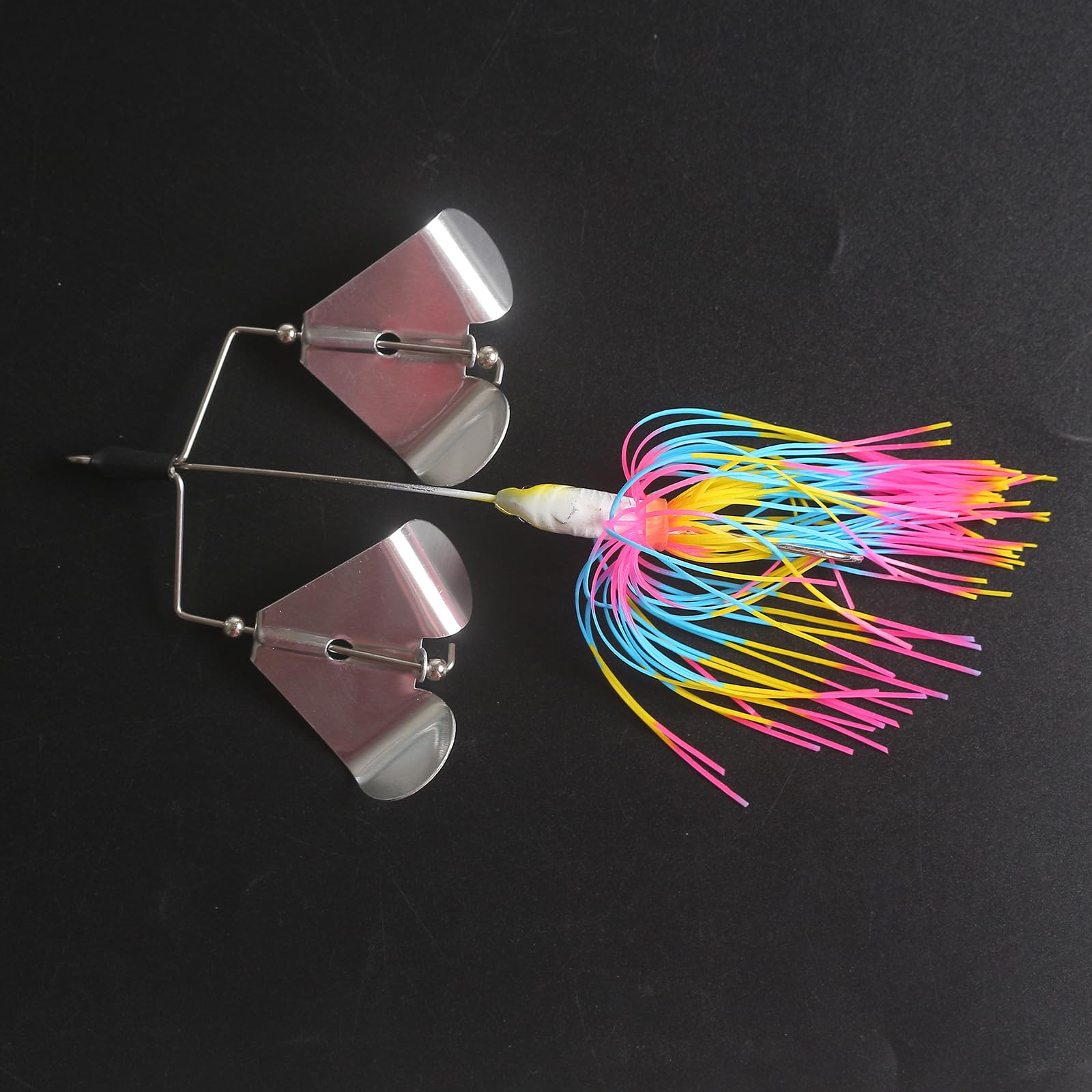 Quintathletic spinner bait green-yellow pattern enhances visibility in water