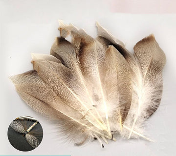 Quintathletic spotted duck feathers display natural patterns suitable for durable flies.