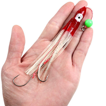 Quintathletic pink glitter squid jig lure enhances visibility near structures