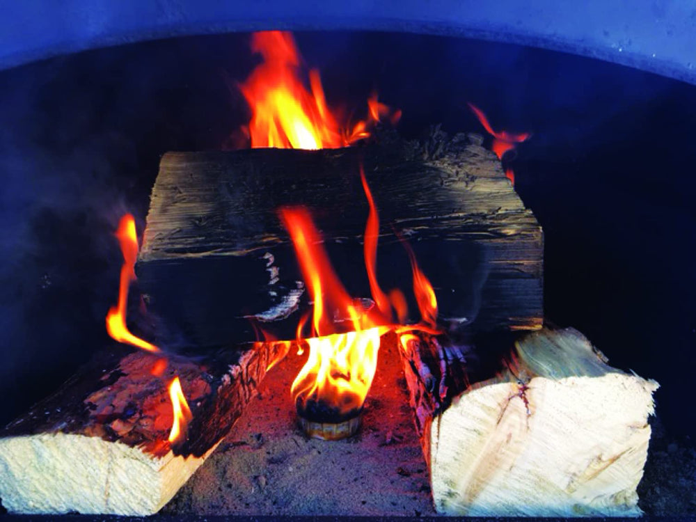 Qwick Wick fire starters beside wood stove for efficient ignition