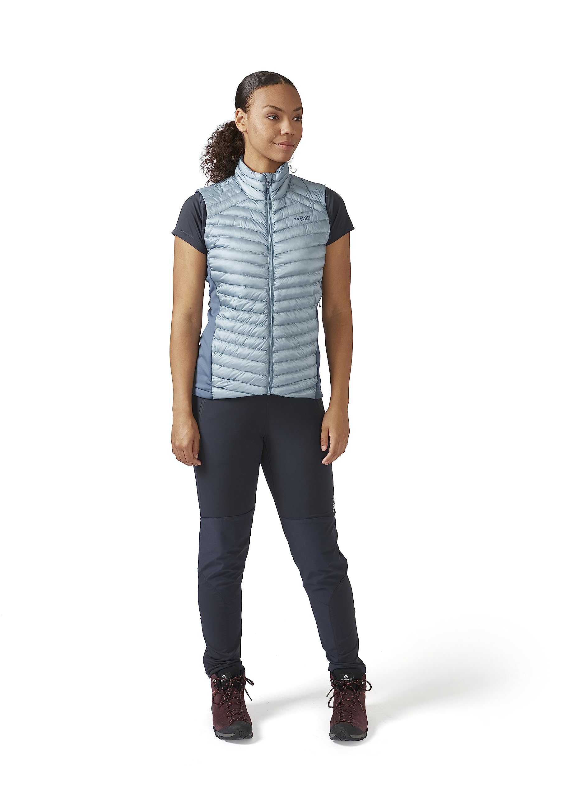 Rab Cirrus Flex 2.0 vest worn by hiker to stay warm during ascent.