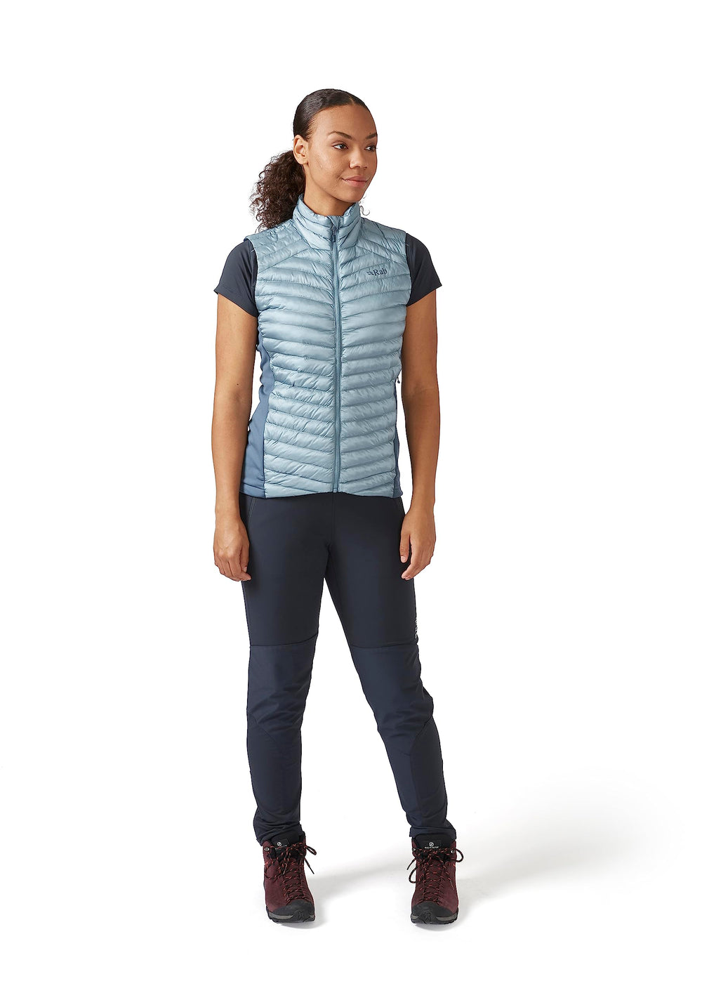 Rab Cirrus Flex 2.0 vest worn by hiker to stay warm during ascent.