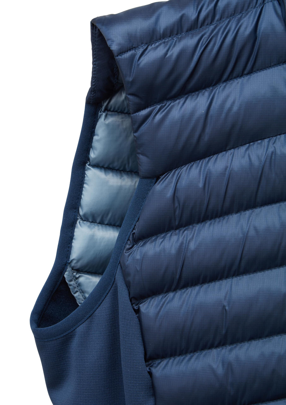Rab Cirrus Flex Vest during skiing scene highlighting insulation in cold weather.