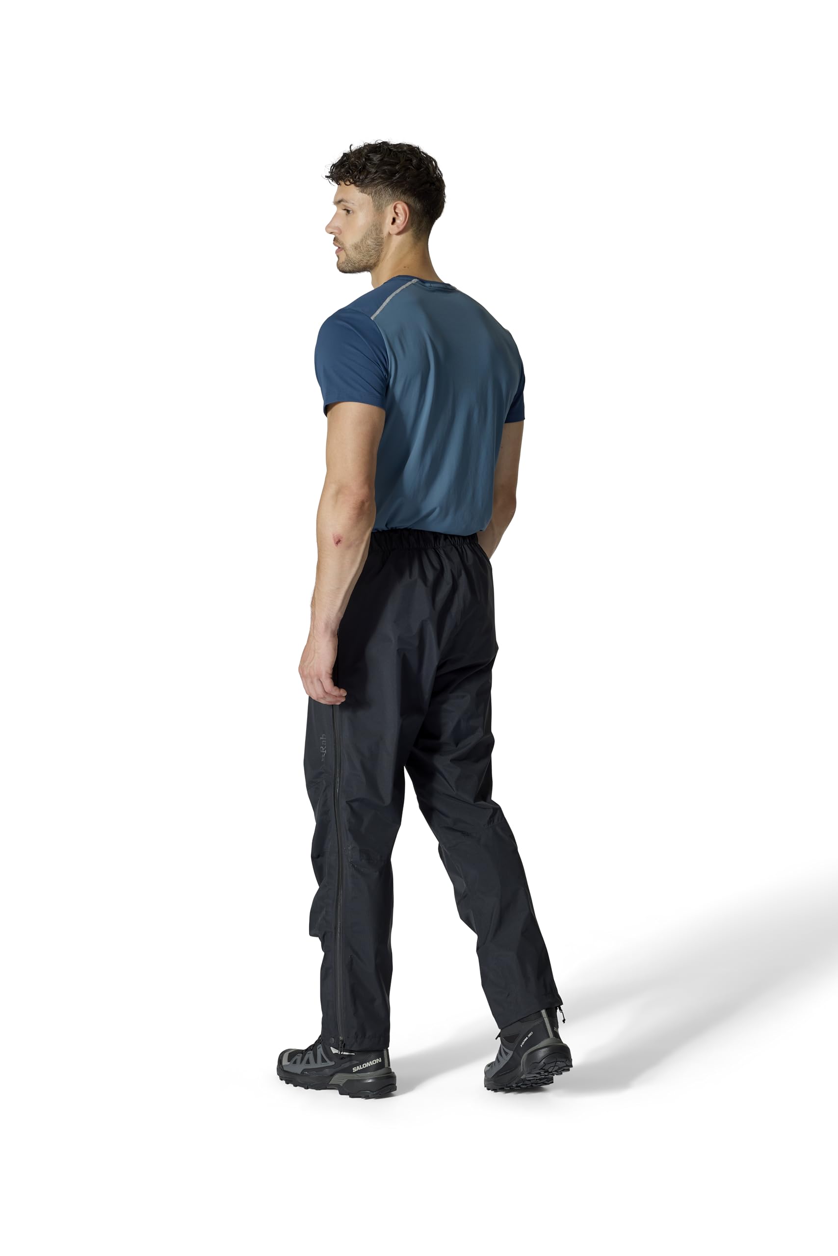 Rab Downpour Mountain Pants packable design demonstrates compact storage for travel