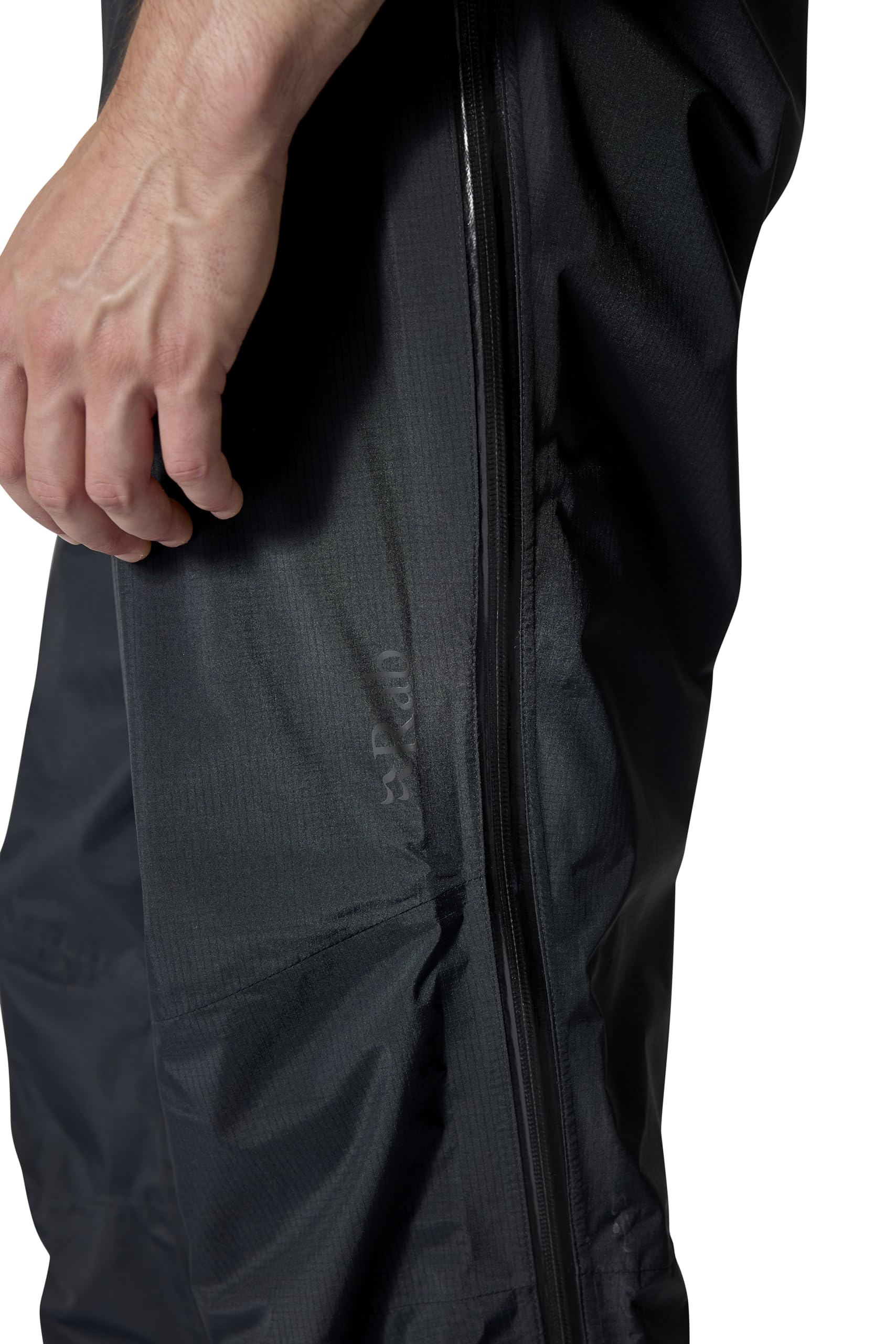 Rab Downpour Mountain Pants on a damp trail scene convey reliable waterproof performance