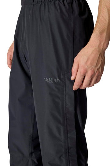 Rab Downpour Pants drawcord hems seal out debris and water on wet trails.