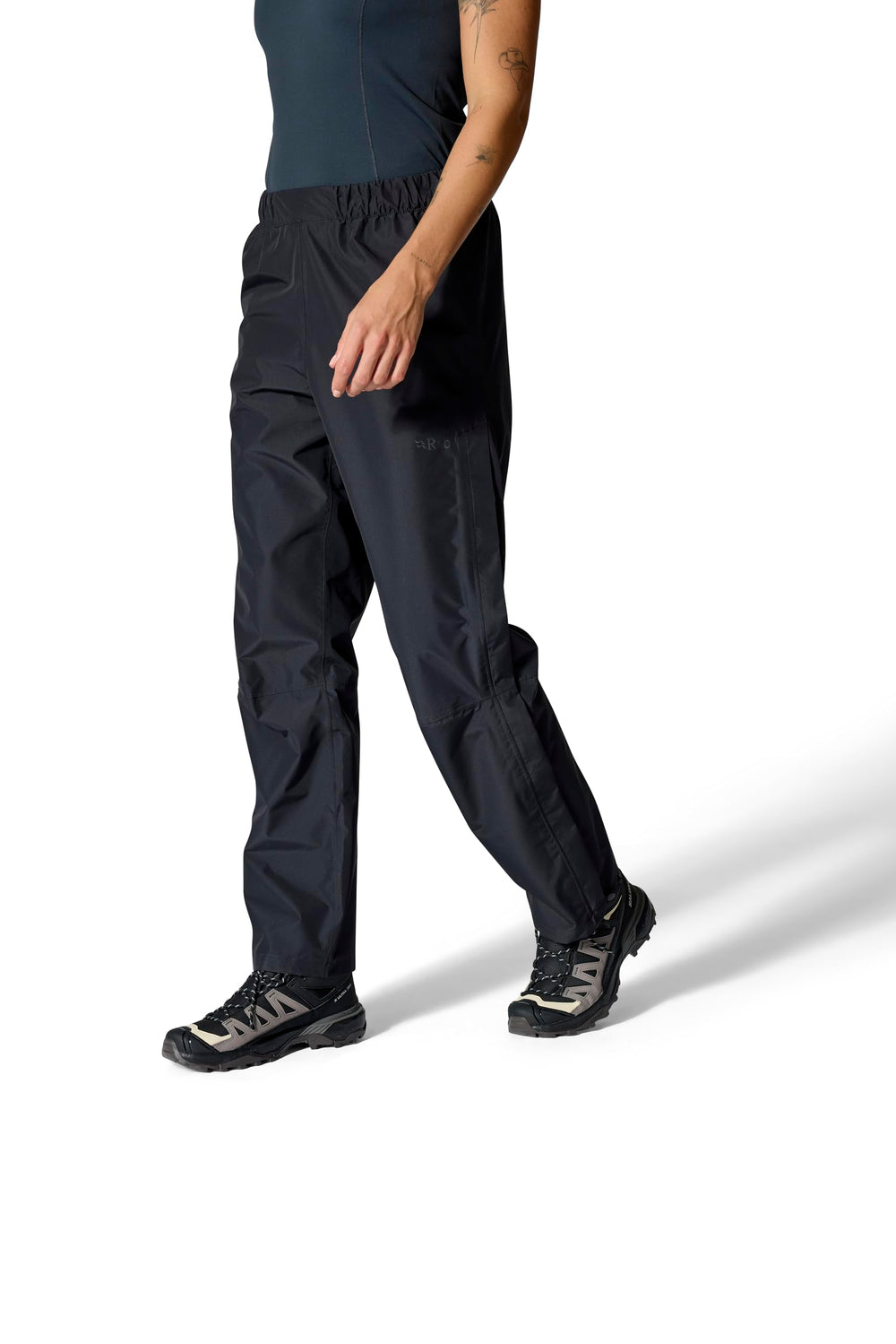 Rab Downpour Pants on trail show quick pull-on over boots during showers