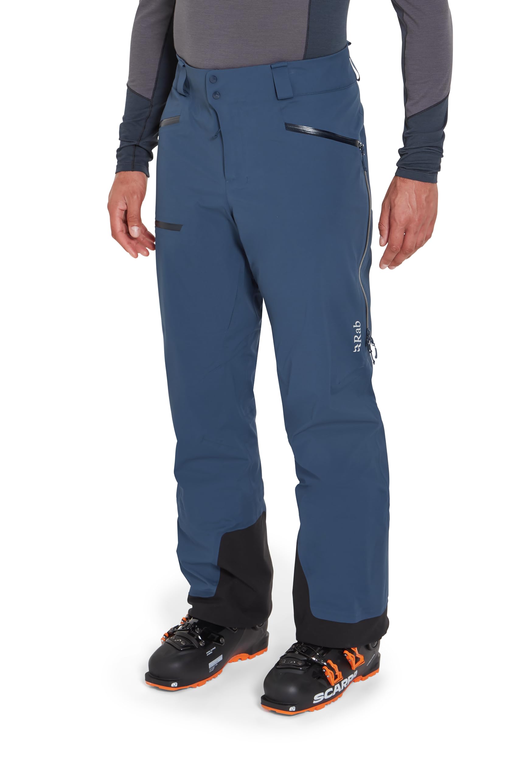 Rab Khroma Kinetic pants illustrate a dawn patrol/backcountry use scenario in Tempest Blue.