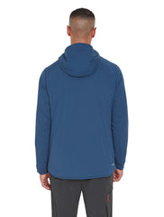 Rab VR Summit jacket worn in rugged mountains shows versatile protection.
