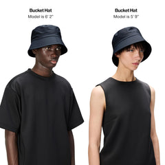 Rains low-brim bucket hat provides rain coverage with lightweight comfort.