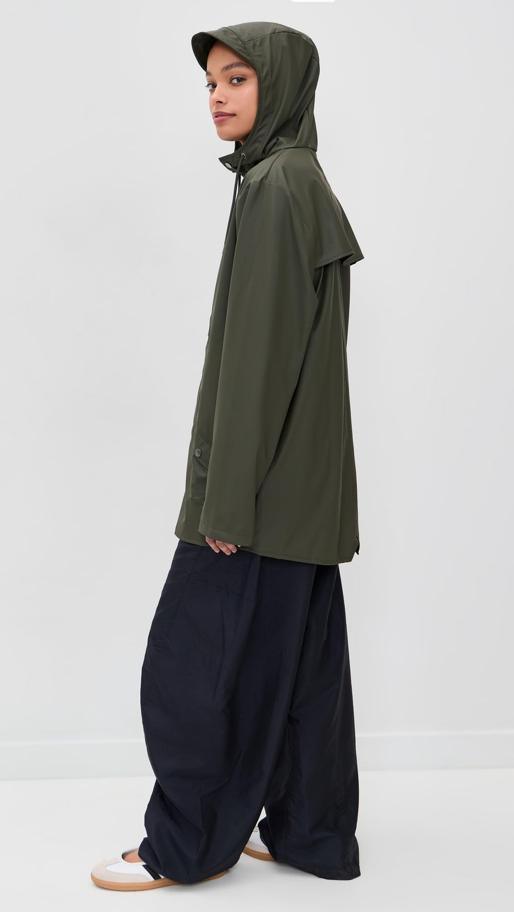 RAINS jacket side pockets: secure storage for essentials on city outings