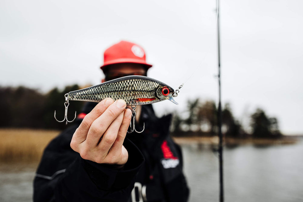 Rapala Super Shadow Rap olive green, hooks closeup showing durable VMC hardware for reliable hookups.