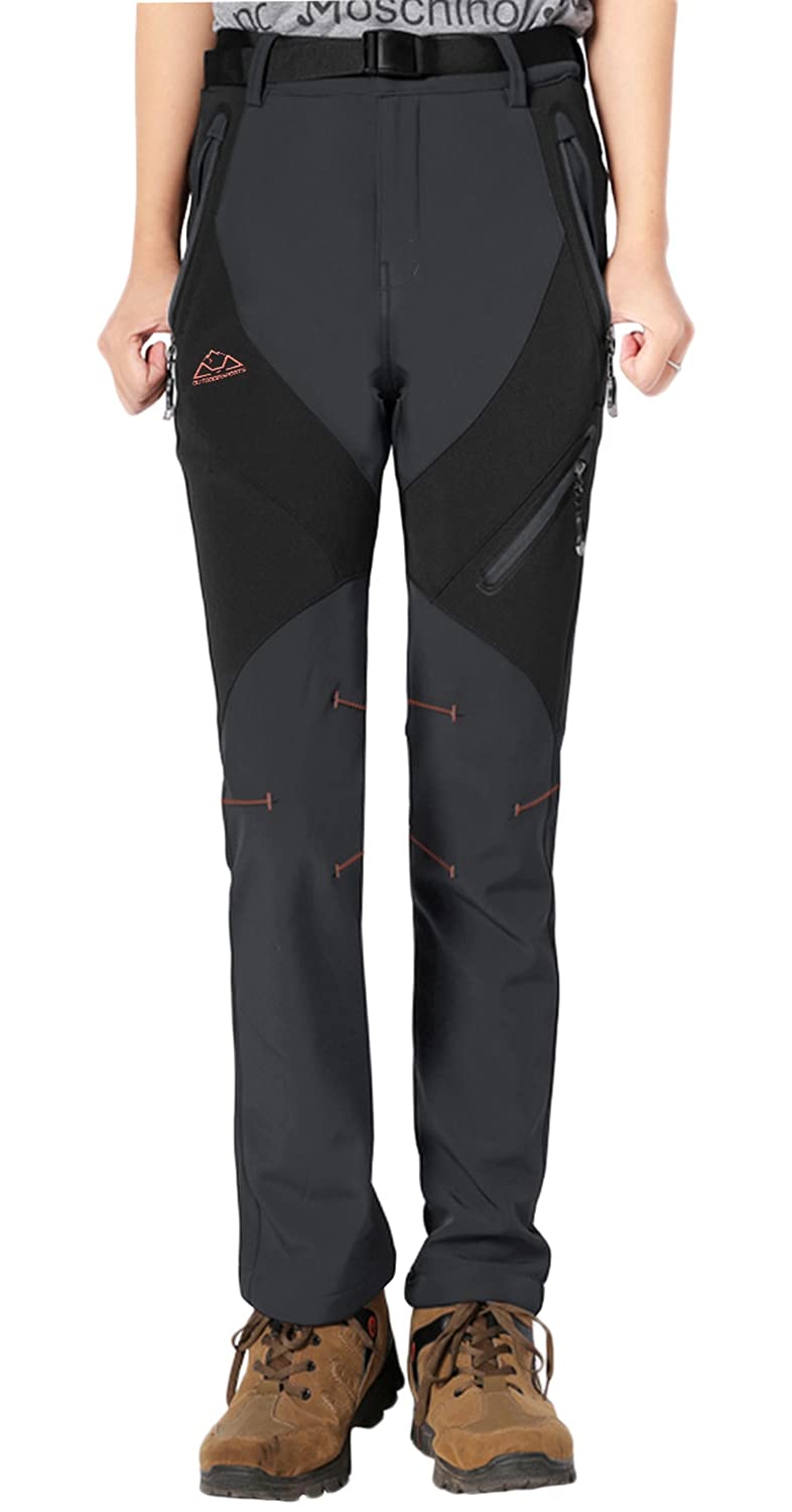 Rdruko women's winter hiking pants windproof outer layer shields against gusts on mountain passes.