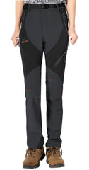 Rdruko women's winter hiking pants windproof outer layer shields against gusts on mountain passes.