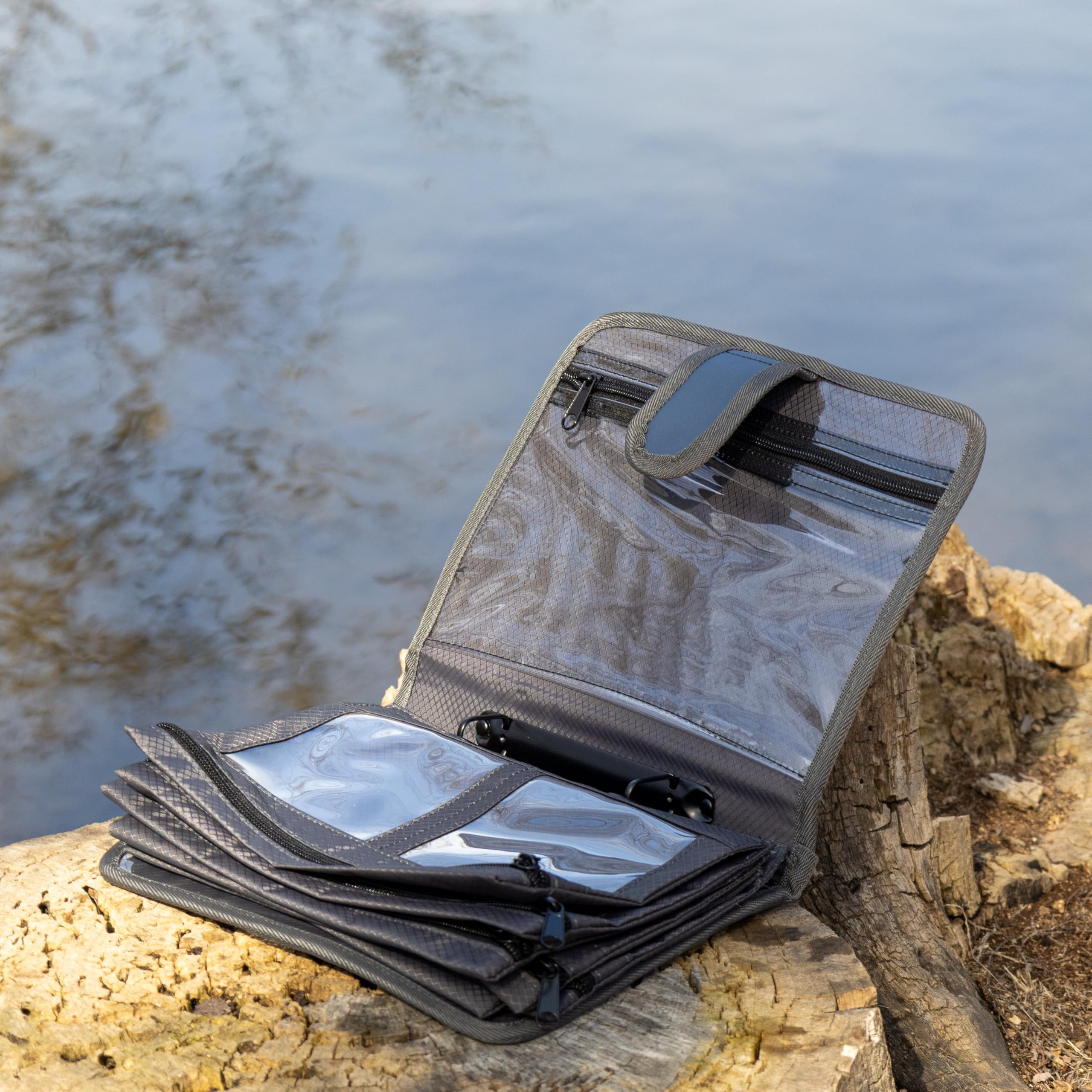 Reaction Tackle Deluxe Speed Binder pocket-inside focus showcases versatile storage for soft plastics and hooks.