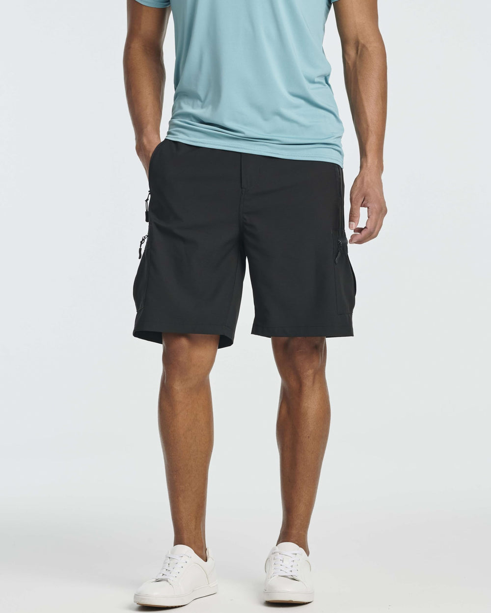 Real Essentials shorts showing secure zipper pockets for trail storage