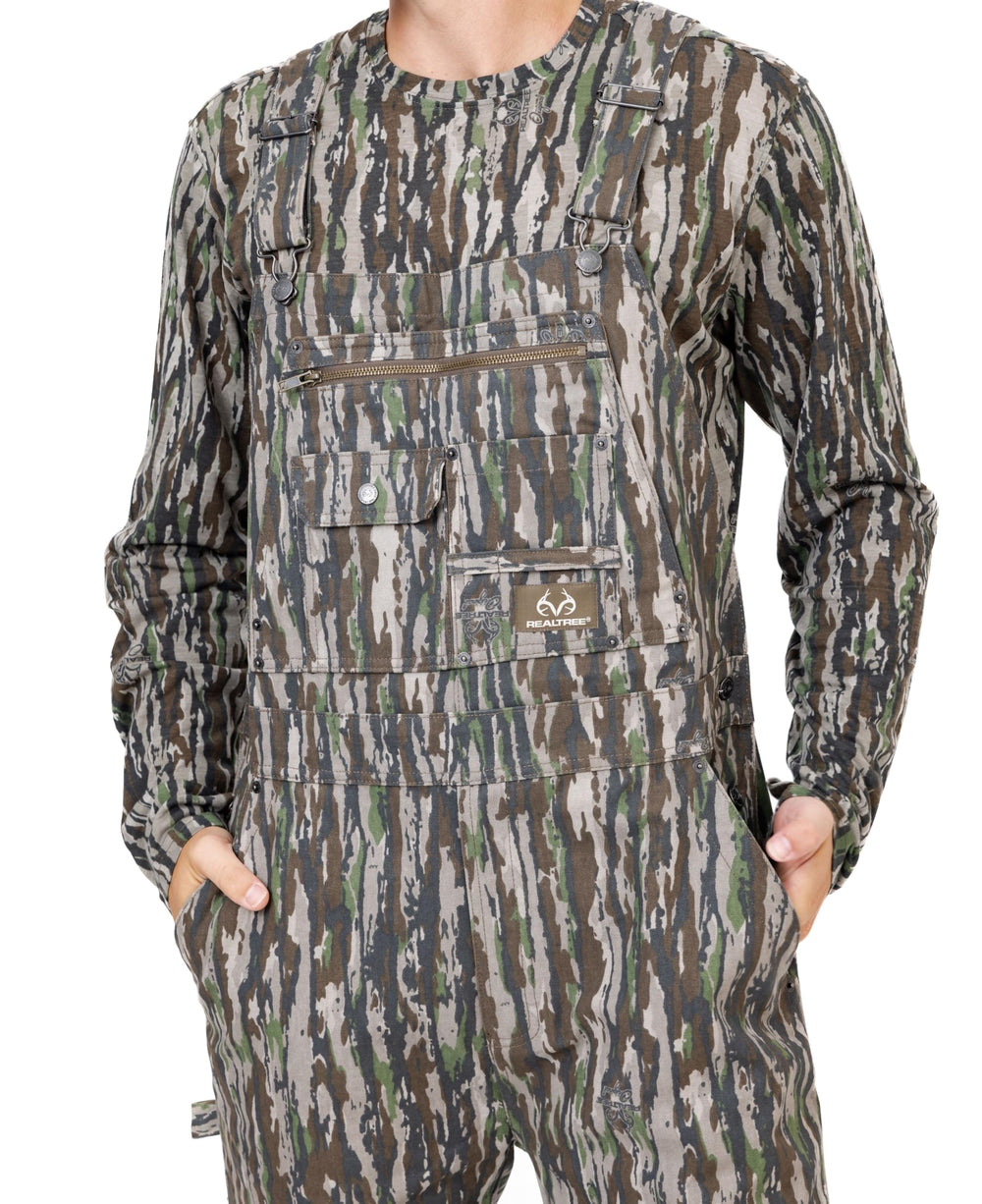 Realtree camo bib overalls with adjustable straps offer customized comfort in the field.
