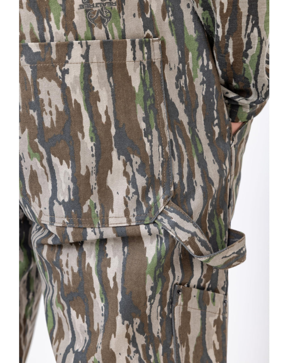 Realtree camo bib front detail on overalls with practical pocket access.