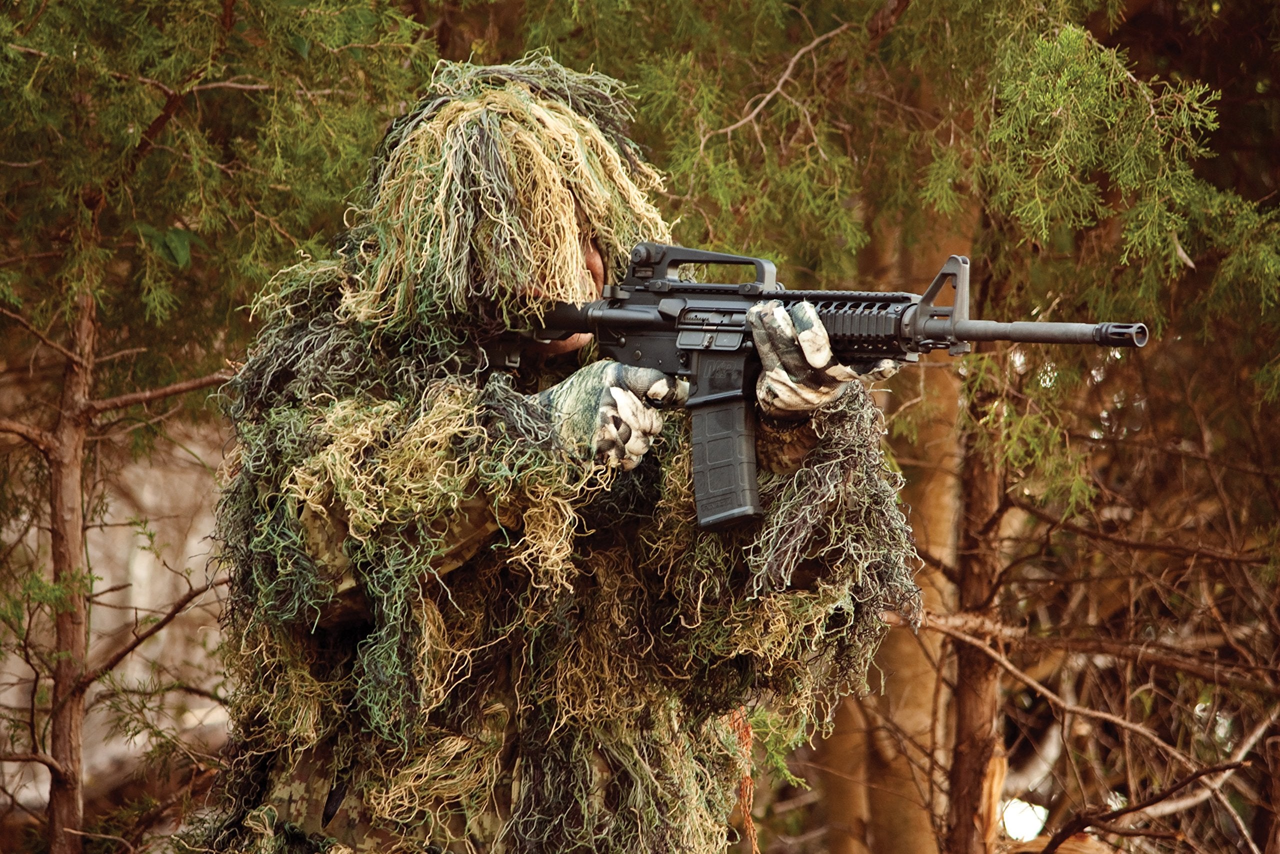 Red Rock ghillie parka adjustable hood chin strap secures coverage.