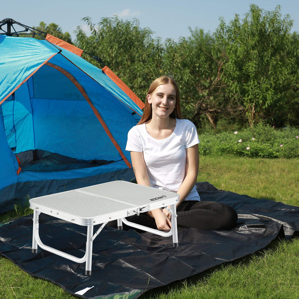 REDCAMP small folding table beach setup ideal for seaside picnics and beverages.