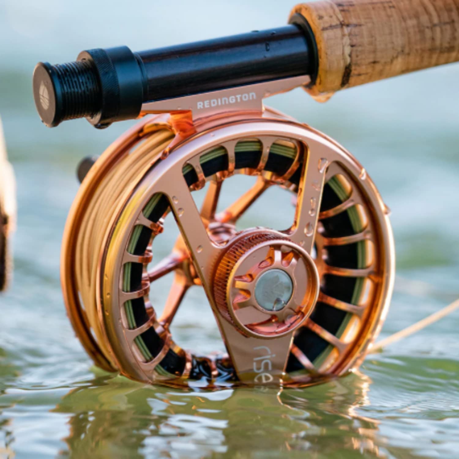 Side view of Redington Rise III 5/6 olive fly reel