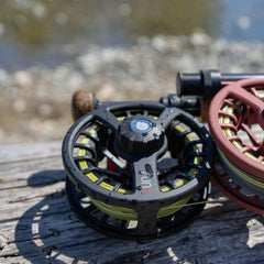 Redington Run fly reel in durable die-cast aluminum with a ported inner barrel.
