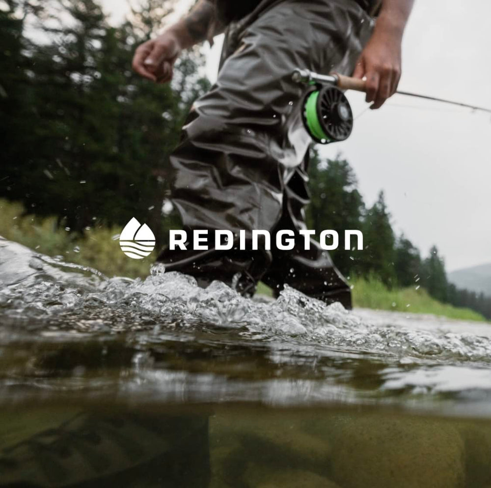 Redington trout-fishing setup on shore highlighting accessibility and readiness.