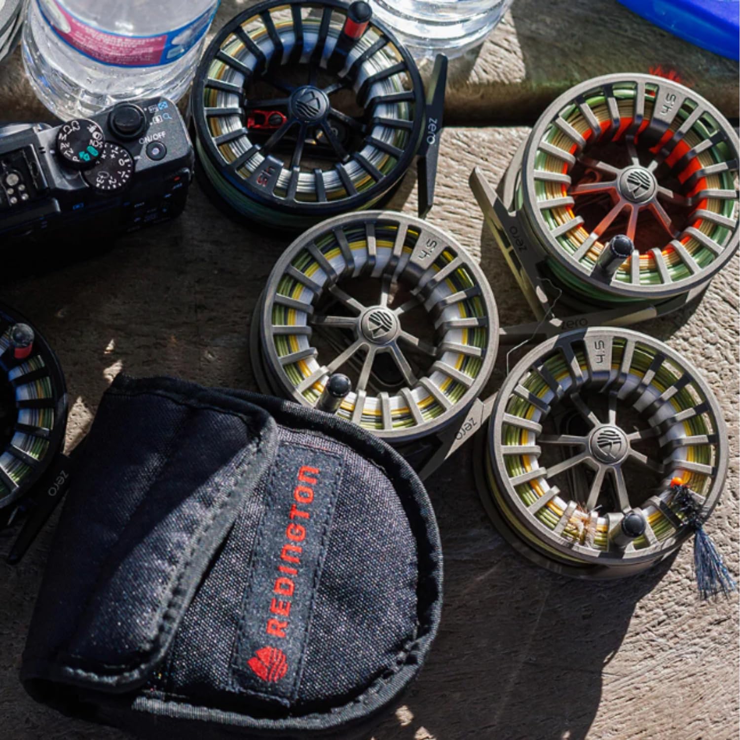 Redington ZERO reel in hand highlights compact size and balanced feel.