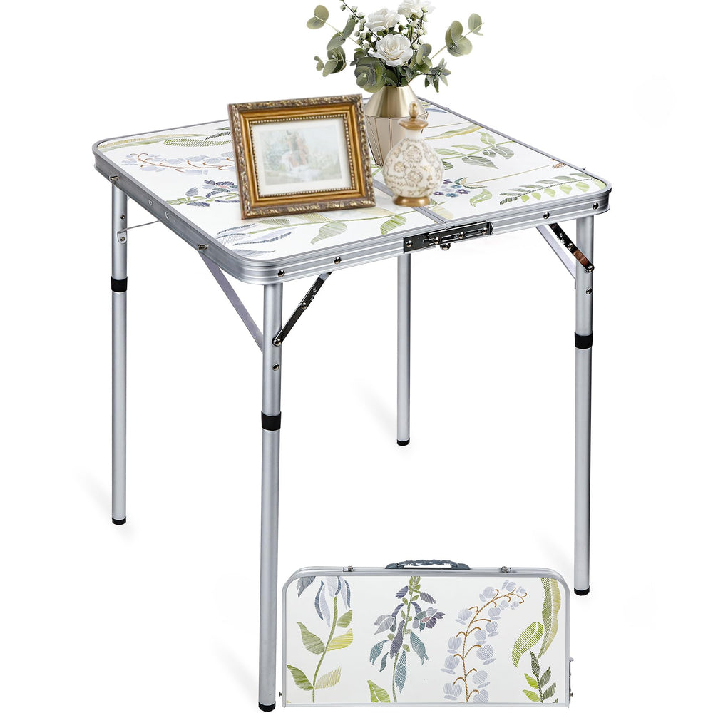 RedSwing 2ft square table folded with carry handle for easy transport.