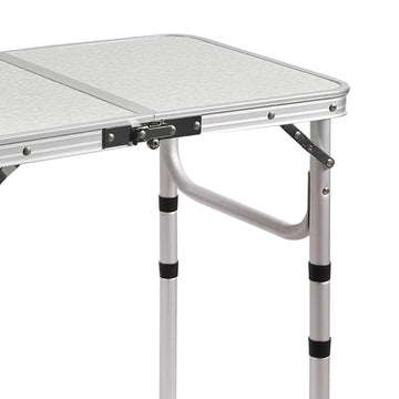 RedSwing lightweight aluminum table at the beach shows versatile use.
