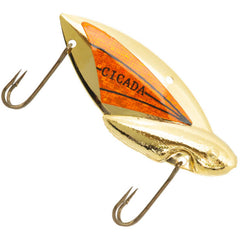 REEF Reef Runner Cicada Lure in gold/orange for vibration and flutter action.