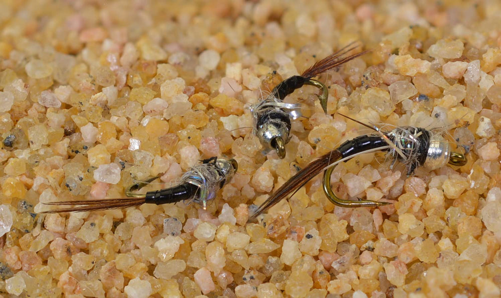 Region Fishing Black Ops Rainbow Warrior Midge Nymph close-up showing brass bead for air-bubble realism.