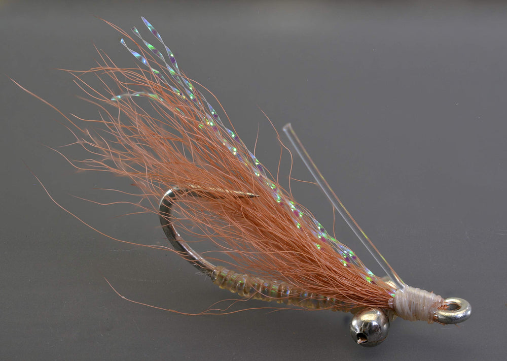 Region Fishing Crazy Charlie tan fly on Mustad Duratin hook attracts bonefish on flats.