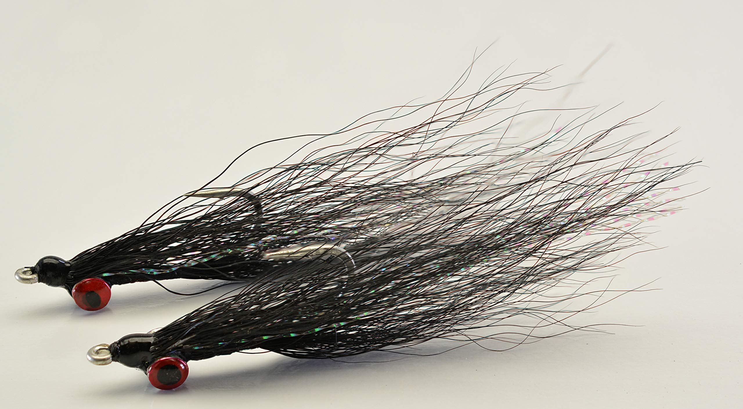 Hand-tied Clouser Minnow flies by Region Fishing ready to tempt a variety of species.
