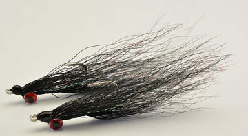 Hand-tied Clouser Minnow flies by Region Fishing ready to tempt a variety of species.