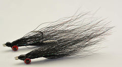 Hand-tied Clouser Minnow flies by Region Fishing ready to tempt a variety of species.