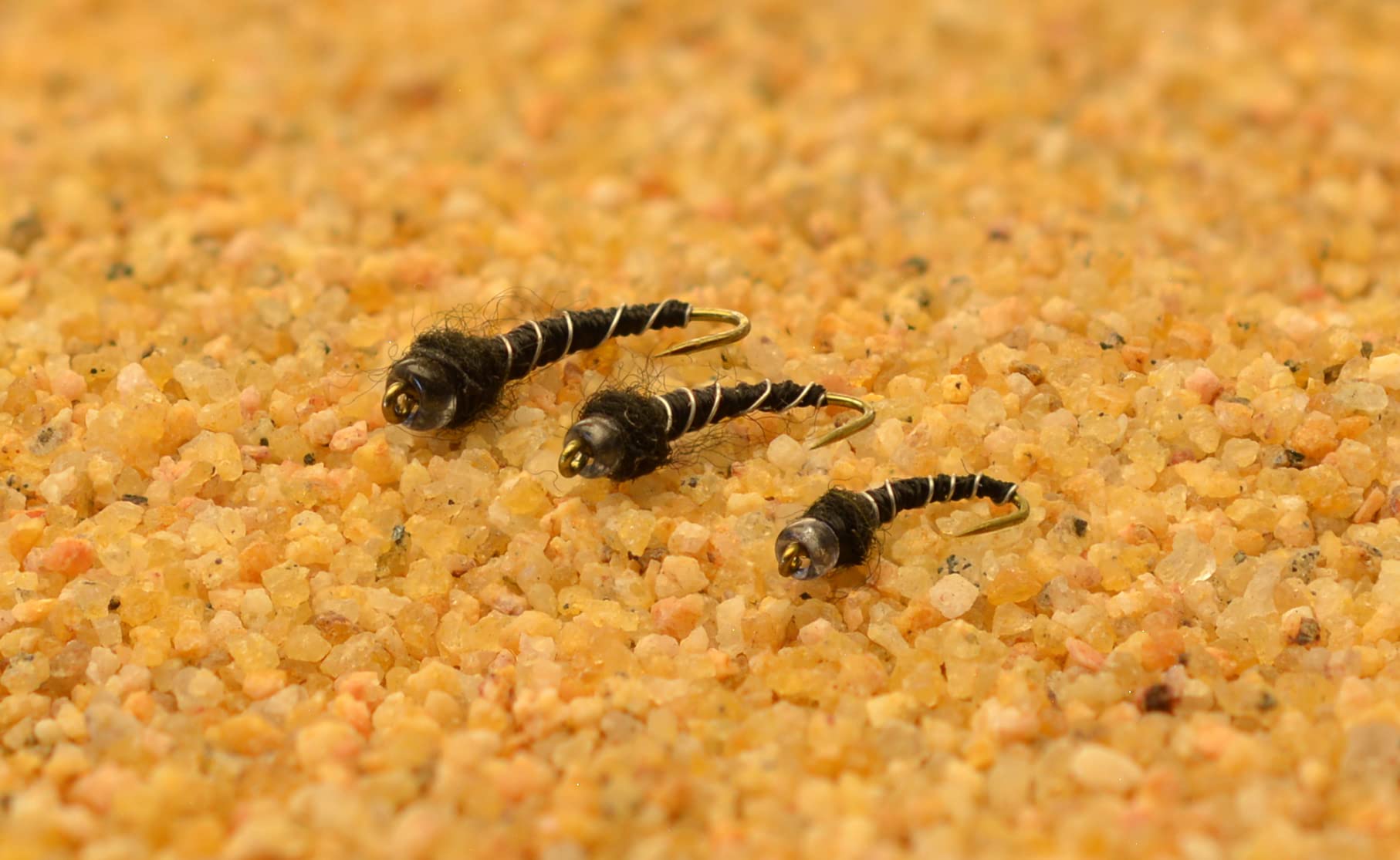Region Fishing Mercury Black Beauty midge with glass bead enhances trout presentation.