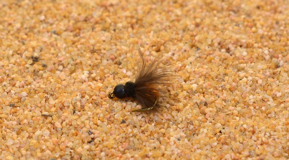Region Fishing October Caddis Emerger Nymph on Mustad Hook #10 with lifelike movement.