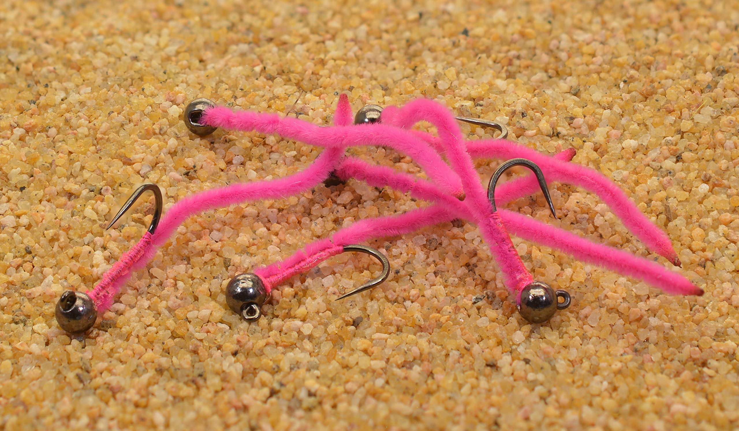 Region Fishing pink San Juan worm jig closeup showing jig hook and barbless design for cleaner hookups.