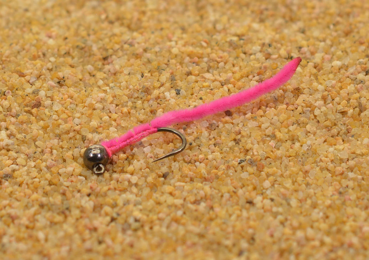 Region Fishing pink San Juan worm jig head closeup with tungsten bead for faster feeding lanes.
