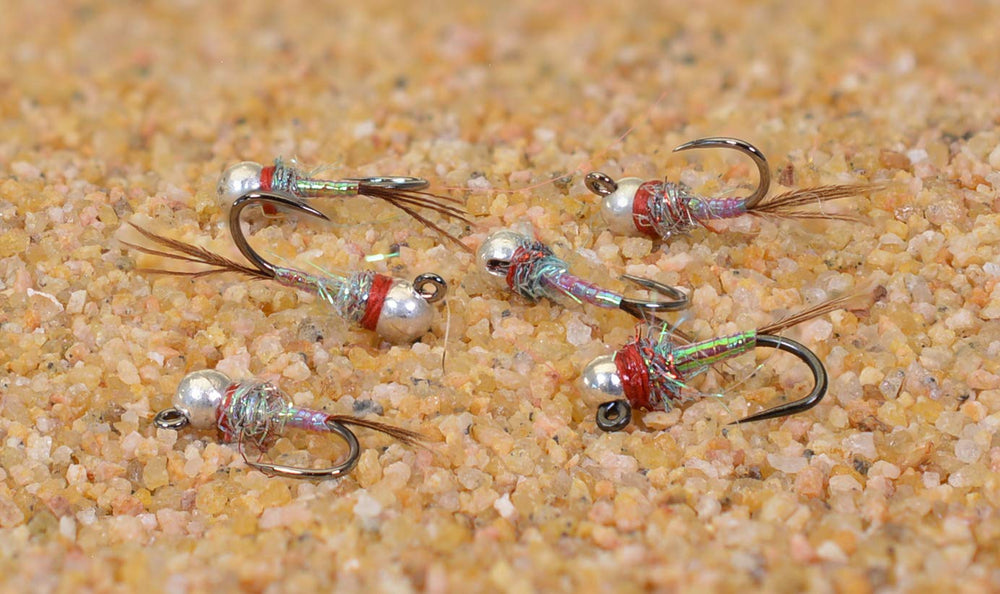 Region Fishing Rainbow Warrior tungsten bead jig fly with Hanak hooks improves casting and snag resistance.