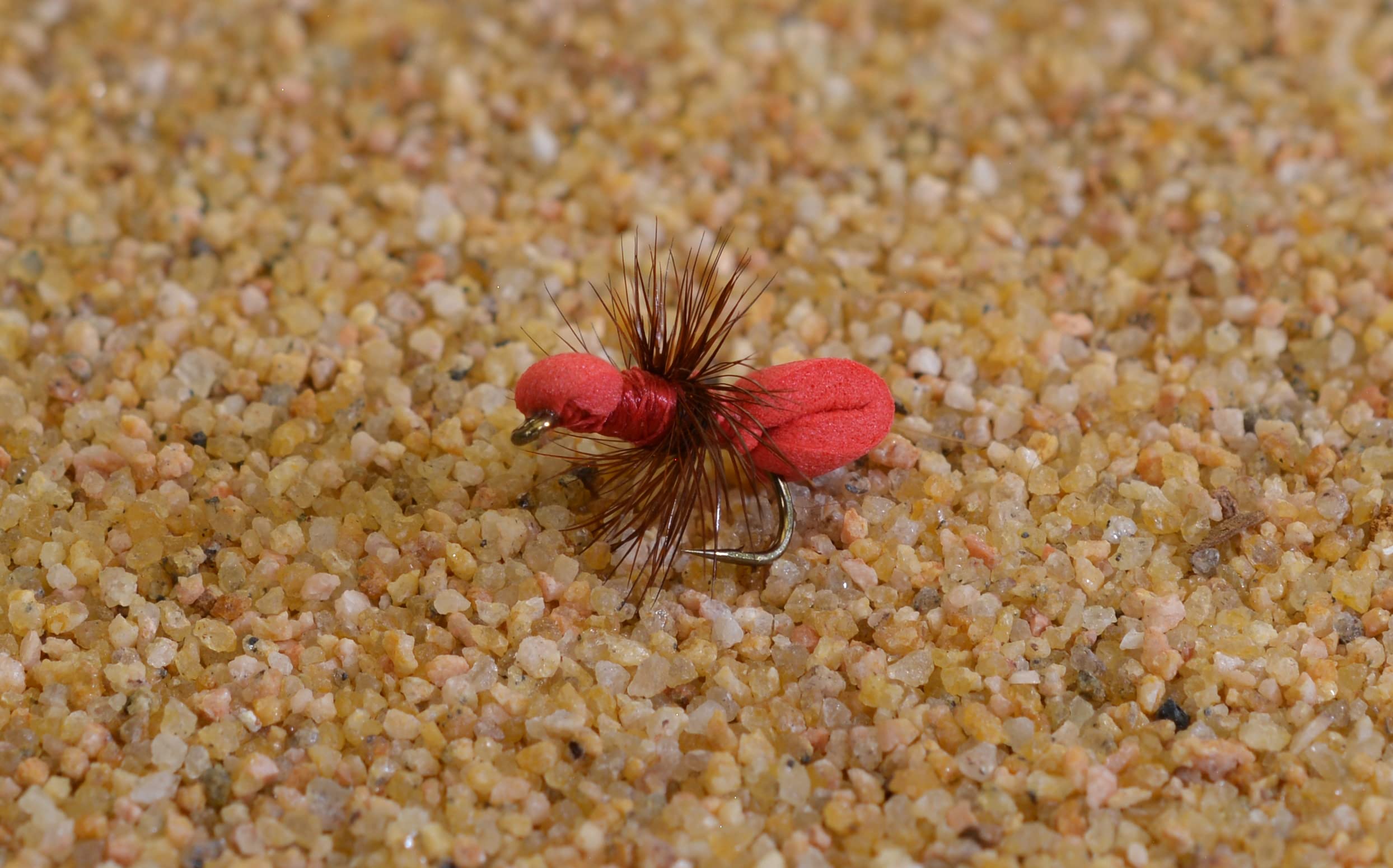 Region Fishing red foam ant dry fly on a Mustad Signature hook, highlighting premium craftsmanship