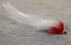 Region Fishing Seaducer saltwater fly in red and white attracts tarpon, snook, and redfish.