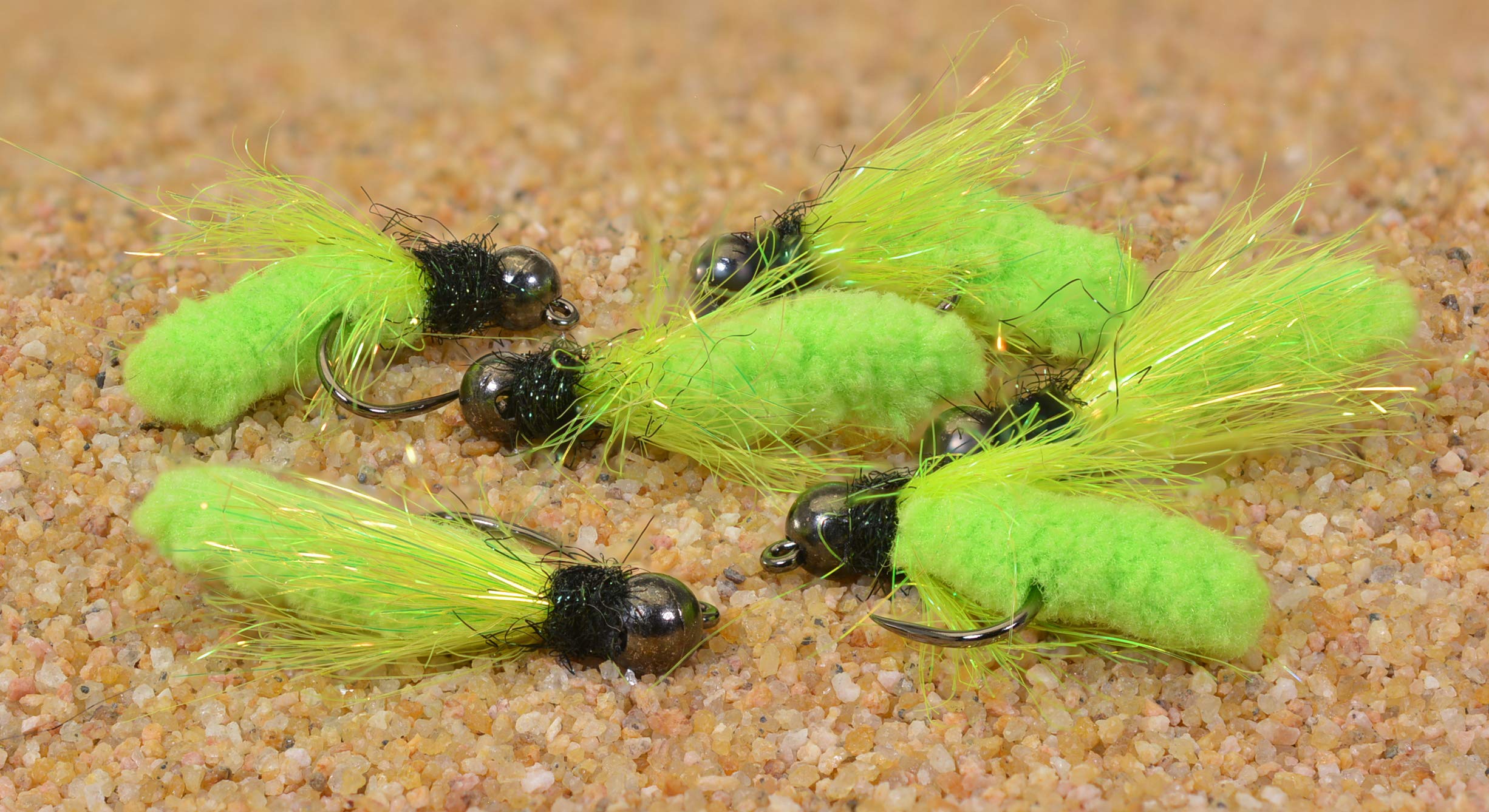 Region Fishing tungsten mop jig fly close-up on chartreuse variant highlighting barbless hook.