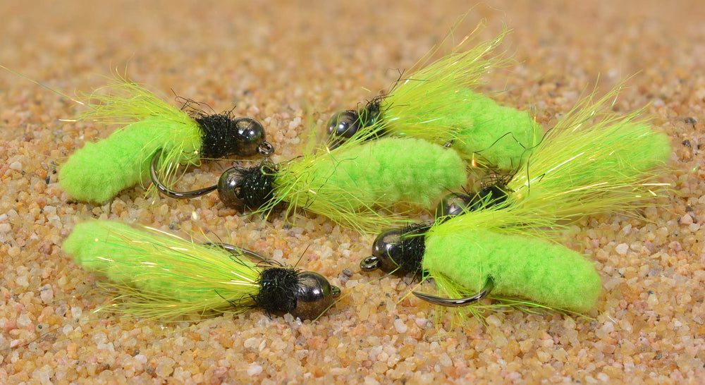 Region Fishing tungsten mop jig fly close-up on chartreuse variant highlighting barbless hook.
