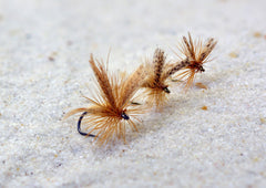 Region Fishing Light Cahill dry fly close-up on water for visibility